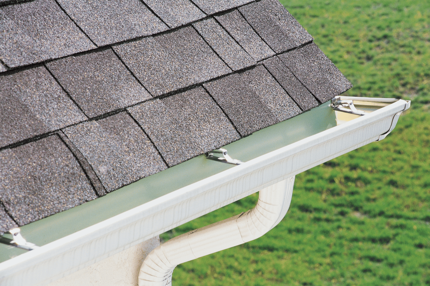 A drawing of gutter guards being installed on a house, showcasing their benefits. 