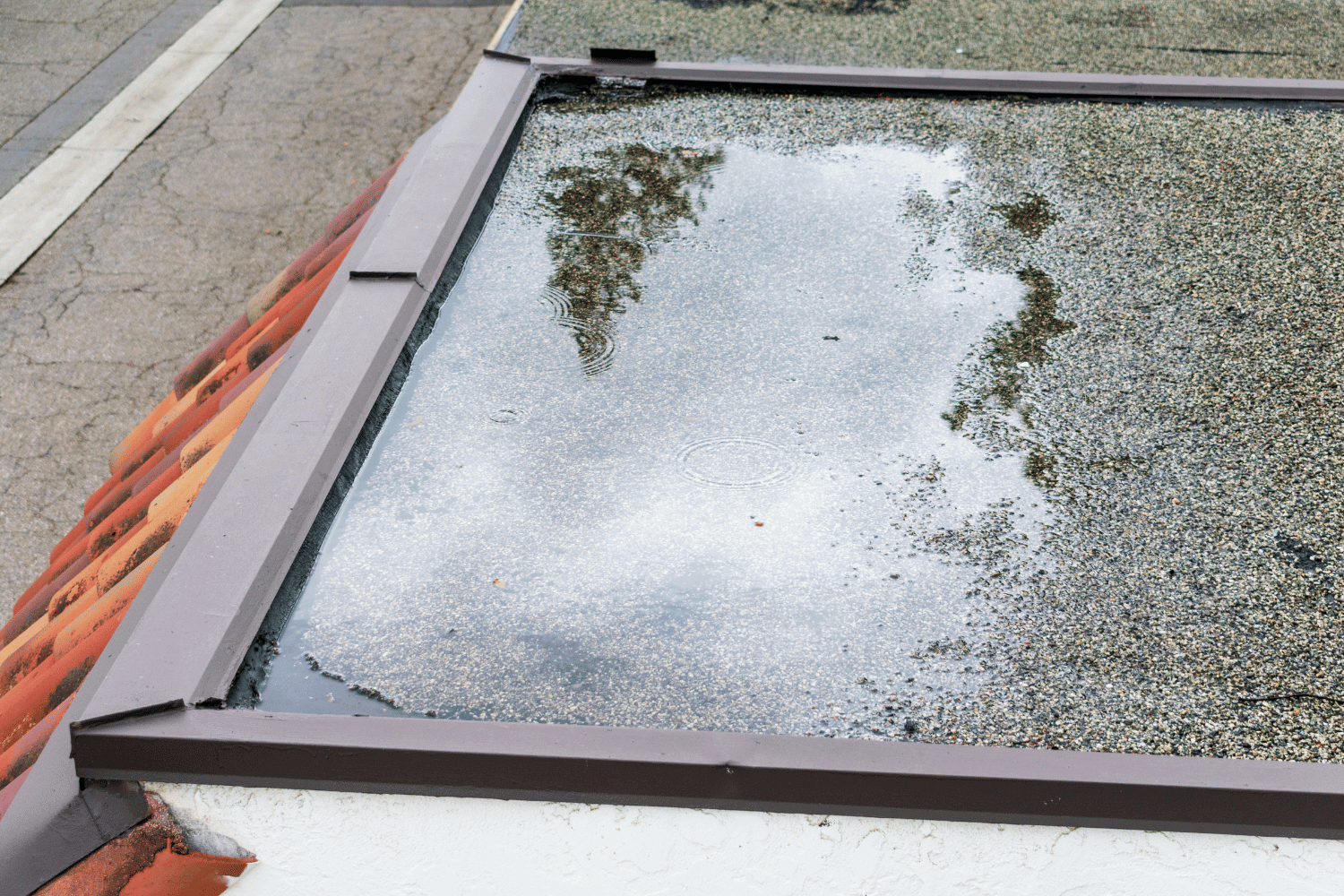 Illustration depicting the concerns of ponding water on flat roofs. 