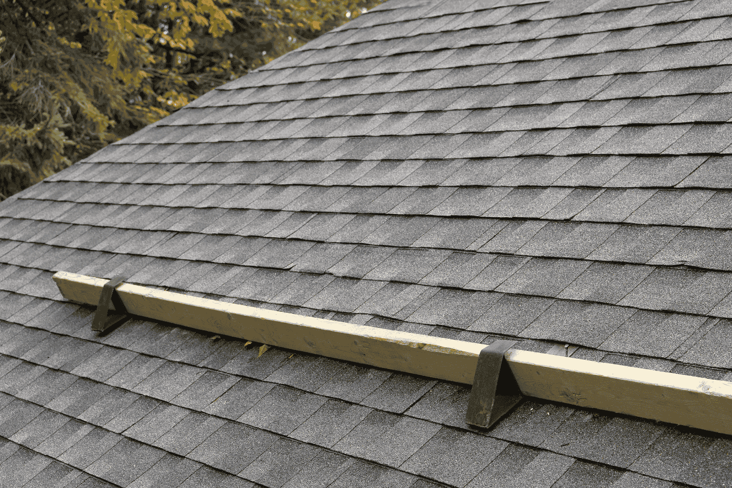 Rolling roof hooks in action during a roofing project.